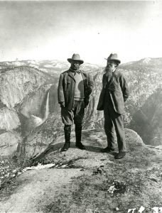 Image shows Theodore Roosevelt and John Muir at Glacier Point overlooking Yosemite Valley, Yosemite National Park, 1906. Library of Congress photograph: Negative Number USZ62-8672.